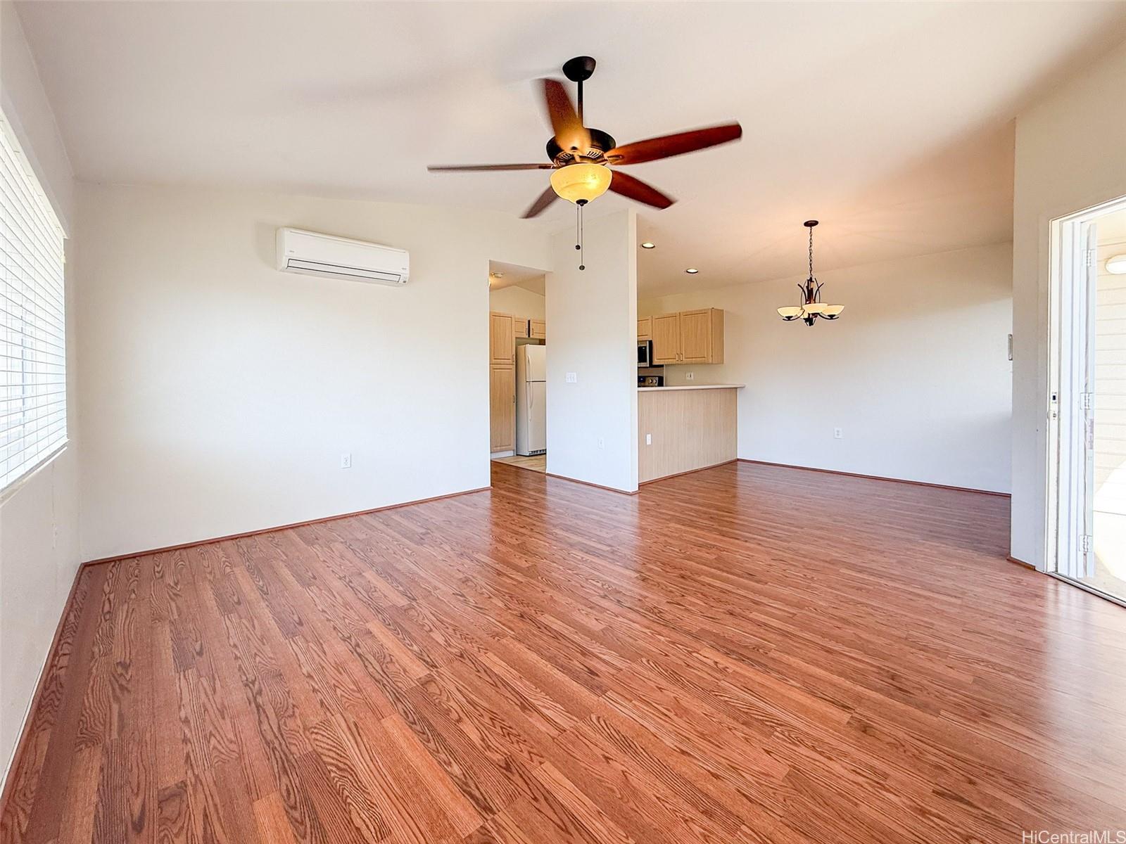 92-1519 Ali'inui Drive, Unit 12A Kapolei, HI 96707 - Photo 22 of 25 a view of empty room with wooden floor and ceiling fan