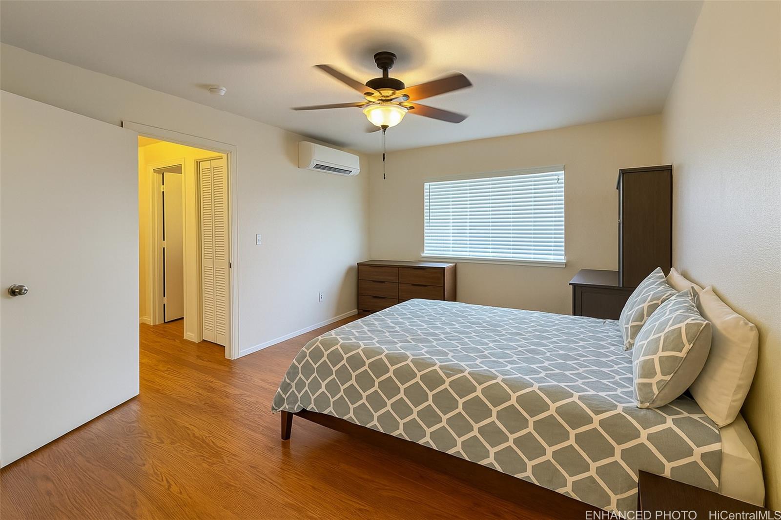 92-1519 Ali'inui Drive, Unit 12A Kapolei, HI 96707 - Photo 6 of 25 a bedroom with a bed and window