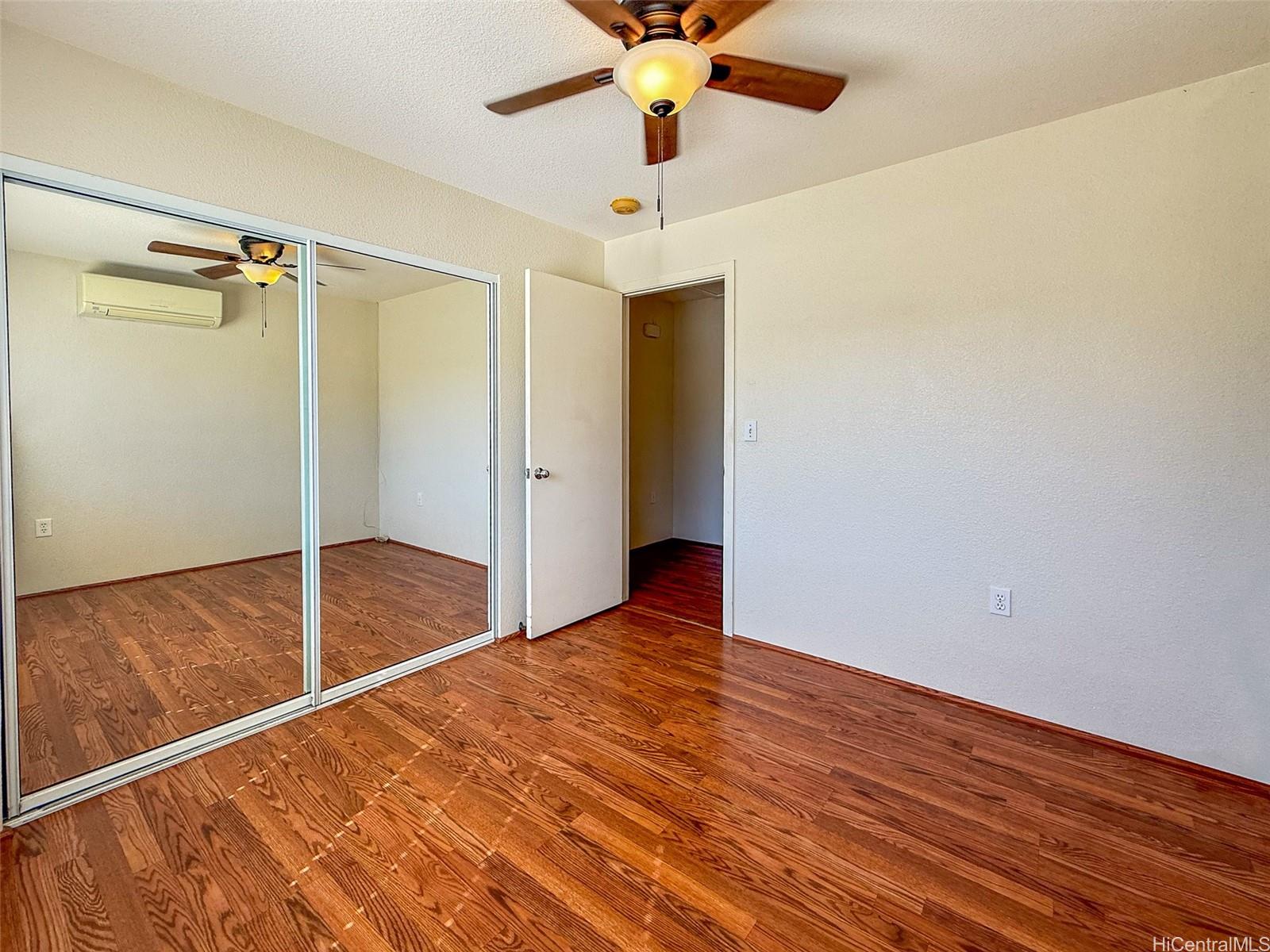 92-1519 Ali'inui Drive, Unit 12A Kapolei, HI 96707 - Photo 10 of 25 a view of an empty room with a window