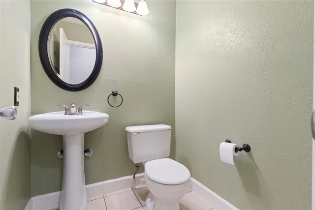 en empty room with window and wooden floor