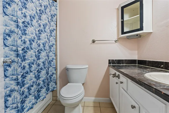 a front view of a house with a garden and porch