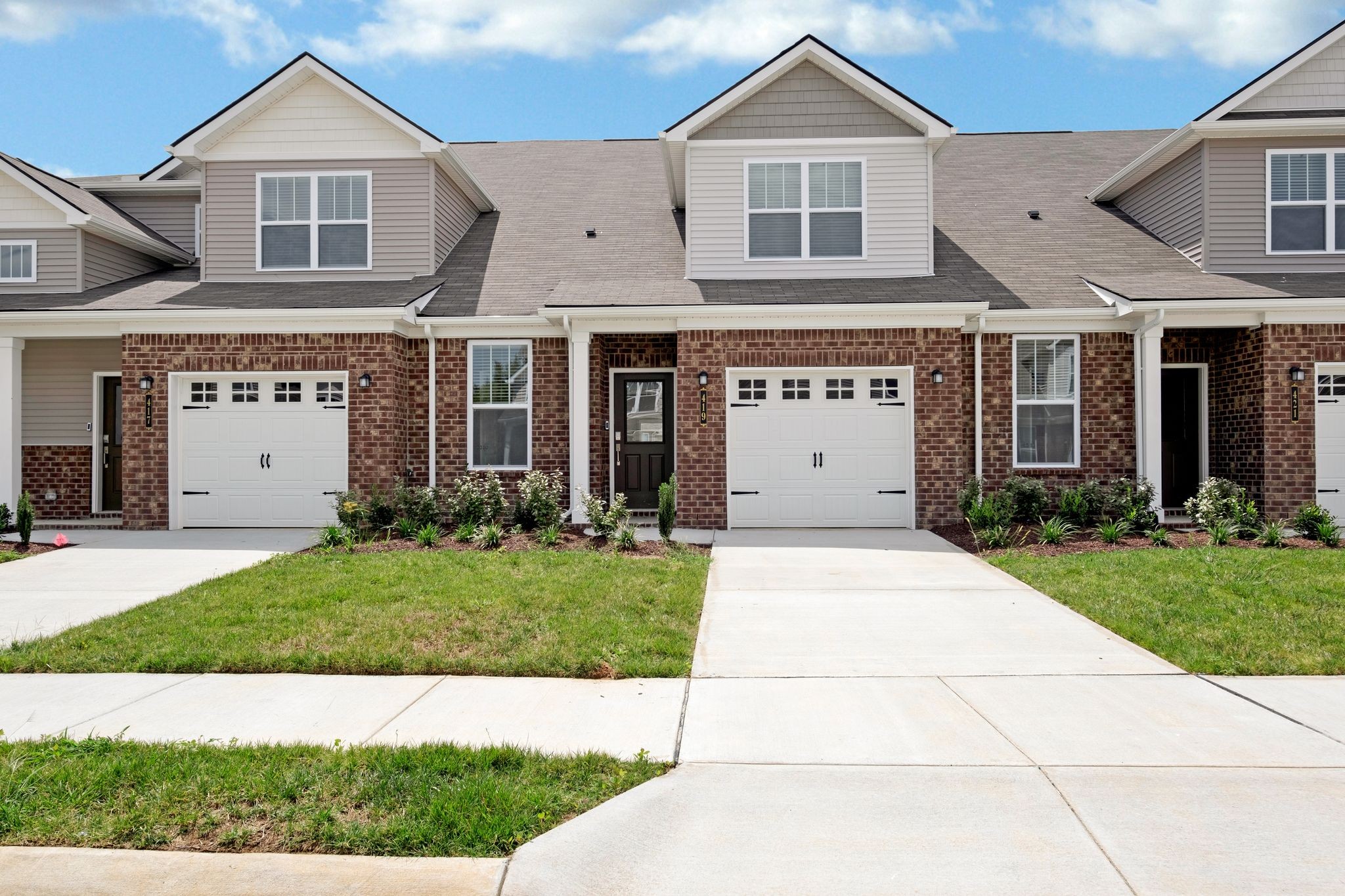 419 Alcott Way Spring Hill, TN 37174 - Photo 1 of 25 a view of a white house with a yard and potted plants