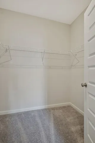 a view of an empty walk in closet