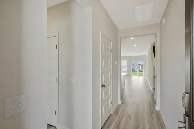 a view of a bathroom from a hallway