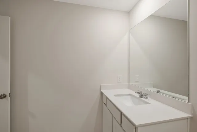 a utility room with dryer and sink