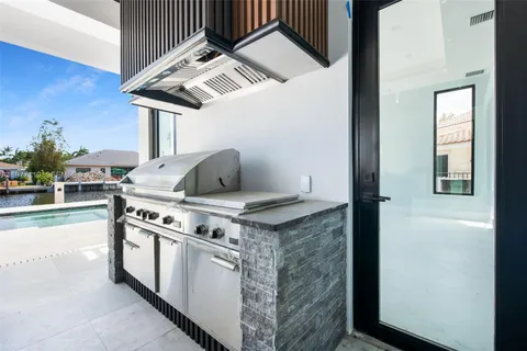 a kitchen with stainless steel appliances granite countertop a sink and a counter space