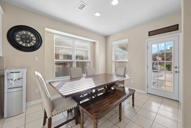 a view of a dining room with furniture and a table