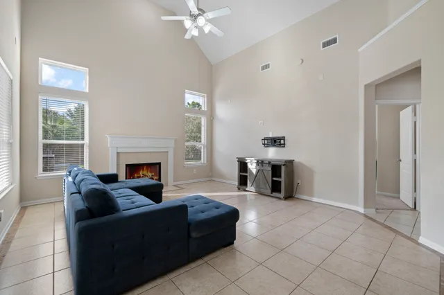 a living room with furniture and fireplace