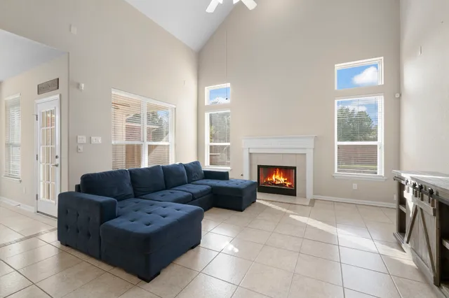 a living room with furniture and a fireplace