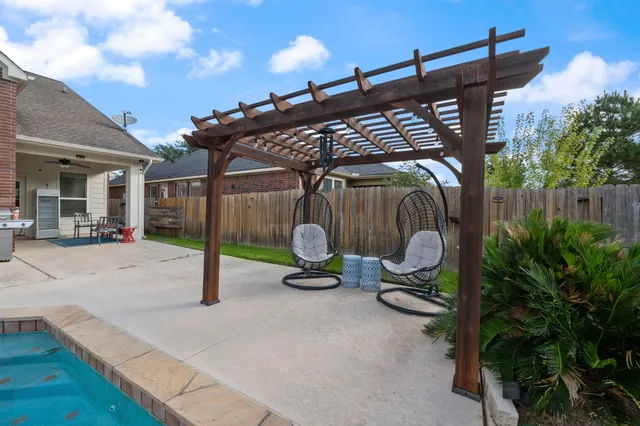a view of a chair and tables in patio