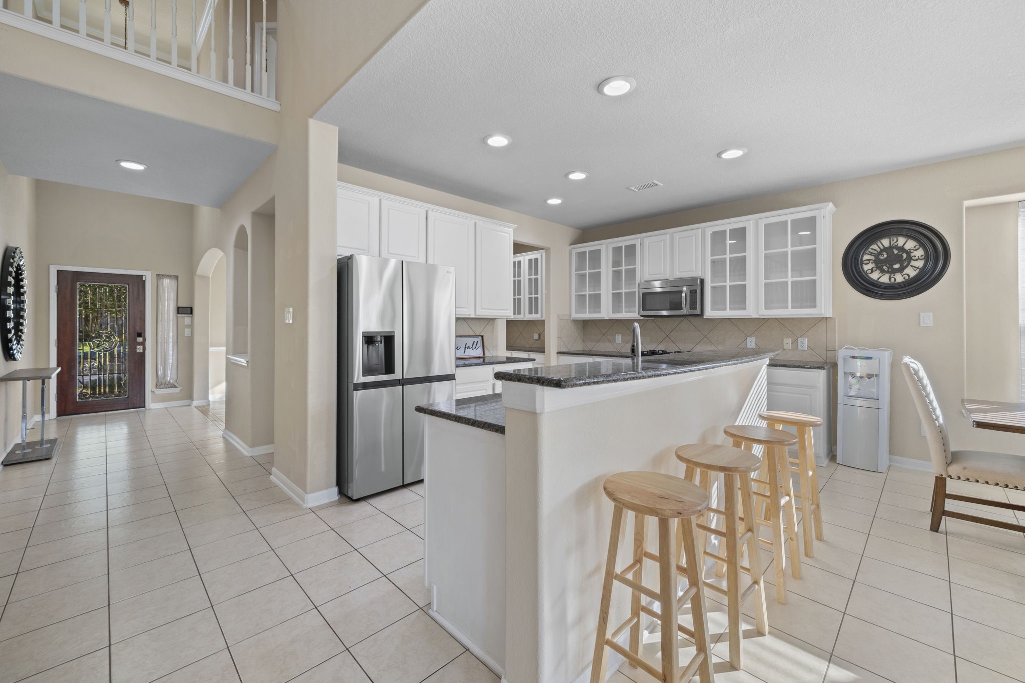 9431 Thurber Ridge Drive Spring, TX 77379 - Photo 9 of 44 Open concept kitchen with breakfast bar and dining area.