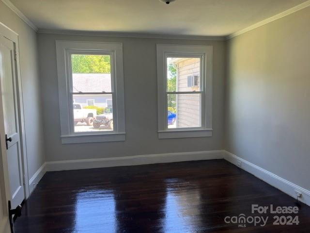 13551 Barberry Avenue Midland, NC 28107 - Photo 17 of 23 a view of an empty room with wooden floor and a window
