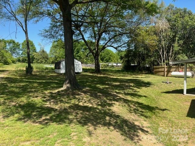 13551 Barberry Avenue Midland, NC 28107 - Photo 3 of 23 a view of a yard with trees