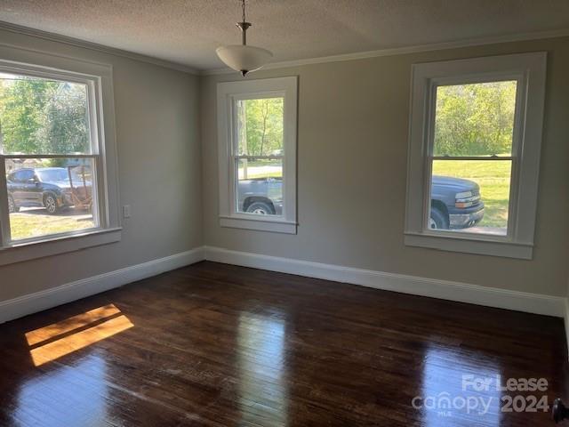 13551 Barberry Avenue Midland, NC 28107 - Photo 6 of 23 a view of an empty room with wooden floor and a window