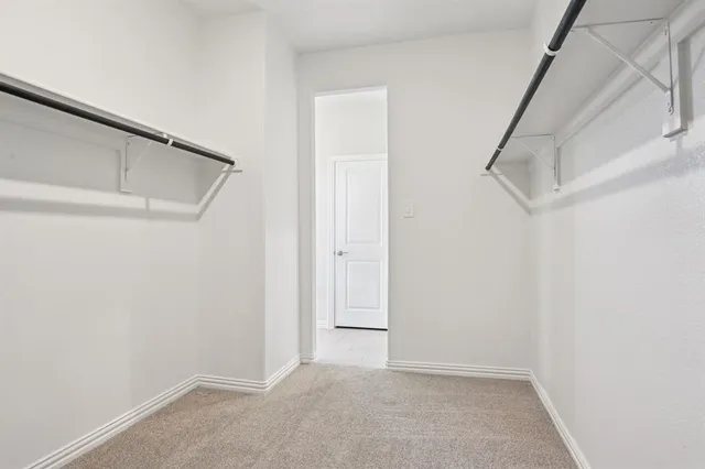 a view of an empty walk in closet