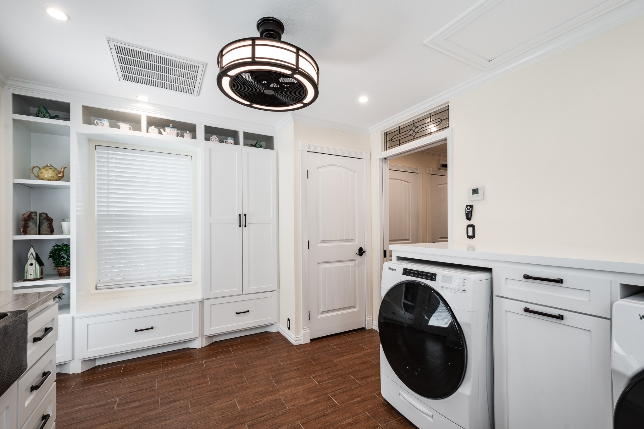 11620 Fostoria Road Cleveland, TX 77328 - Photo 13 of 26 a view of a storage & utility room with washer and dryer