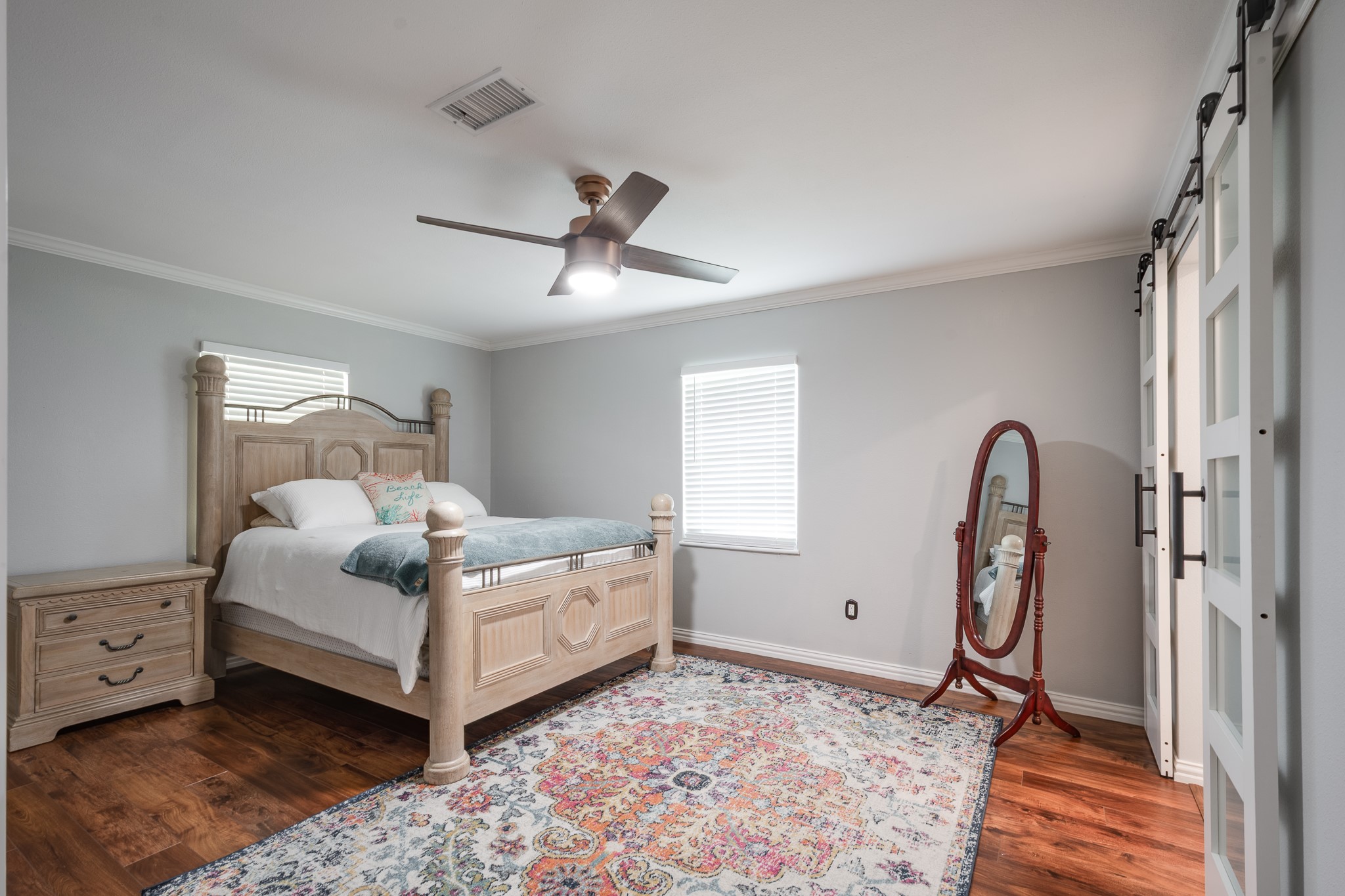 11620 Fostoria Road Cleveland, TX 77328 - Photo 14 of 26 a bedroom with a bed wooden floor and window