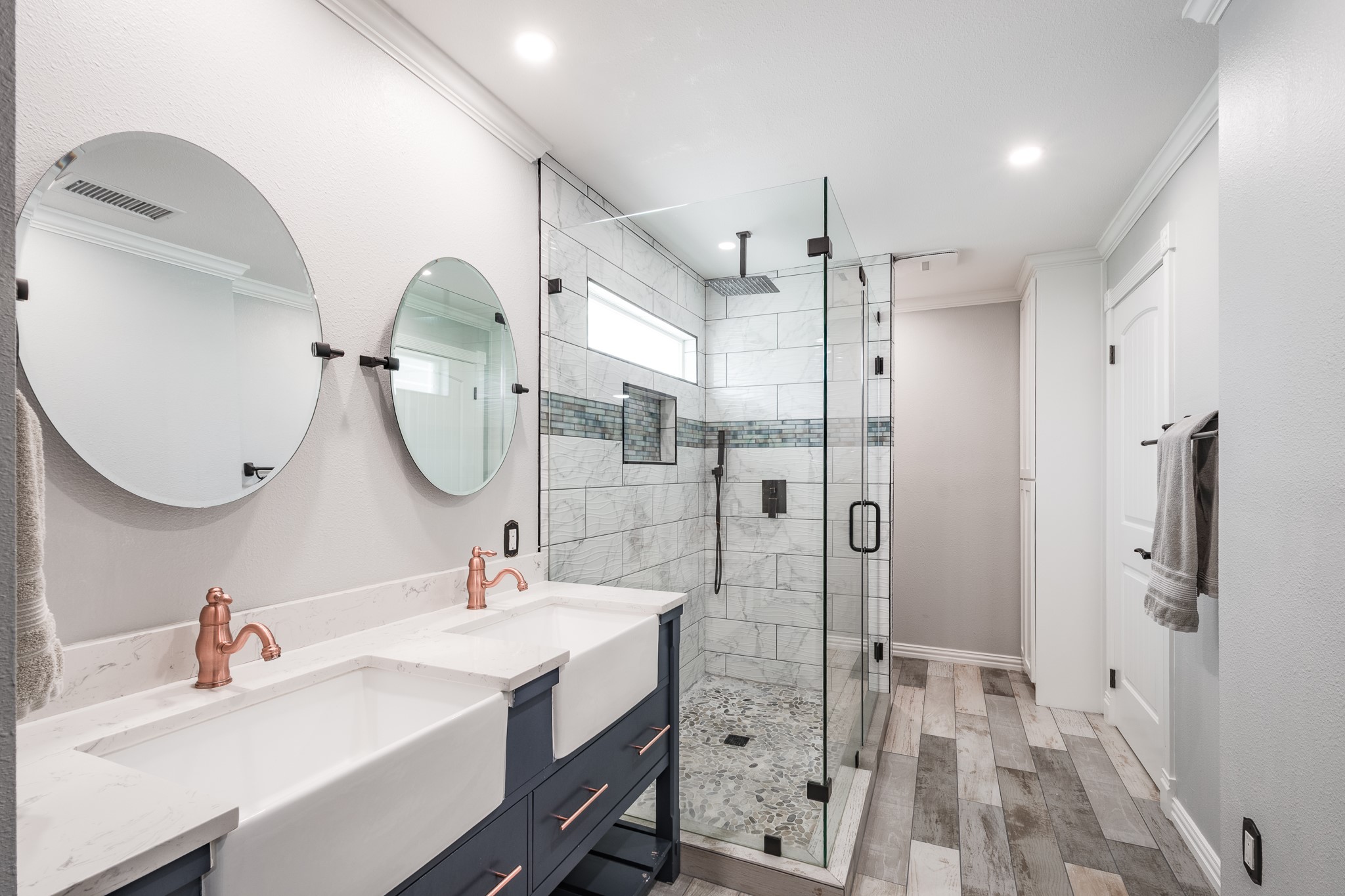 11620 Fostoria Road Cleveland, TX 77328 - Photo 16 of 26 a bathroom with a sink double vanity and a mirror