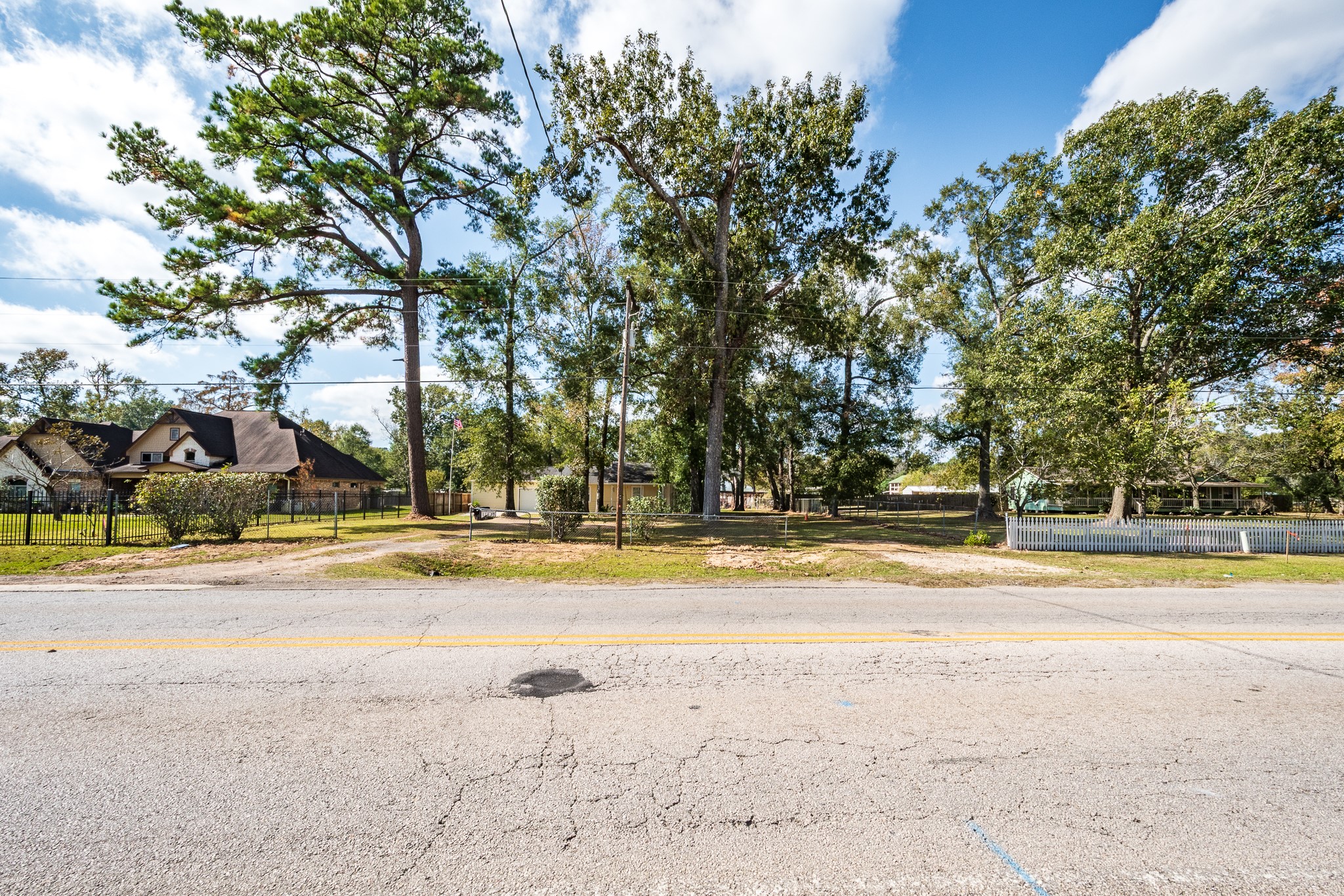 11620 Fostoria Road Cleveland, TX 77328 - Photo 21 of 26 a view of a swimming pool with an outdoor space and seating area