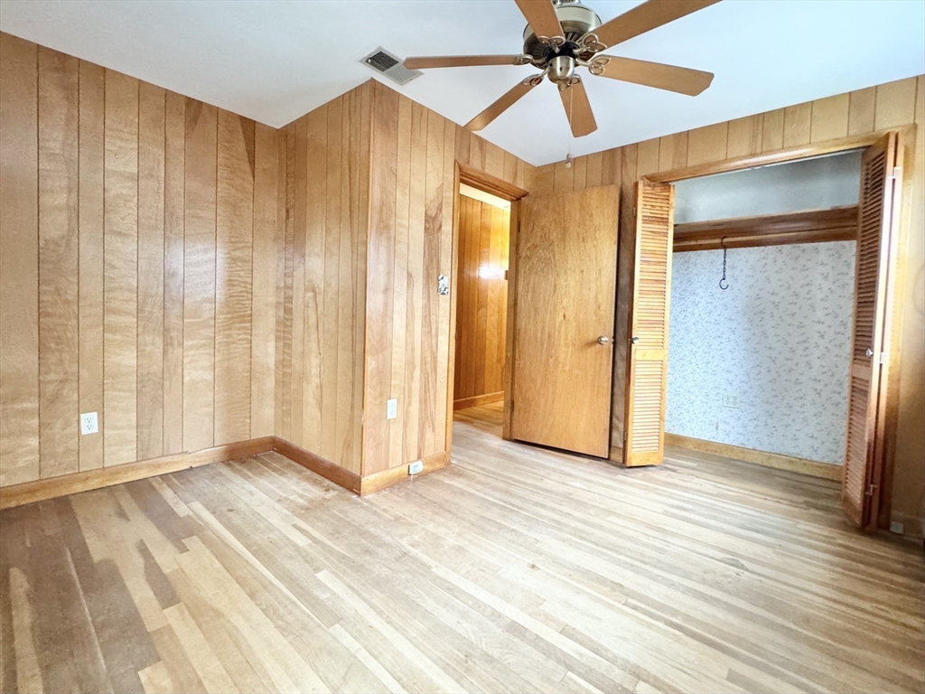 7 Roland Road Peabody, MA 01960 - Photo 13 of 24 a view of an empty room with wooden floor and a window