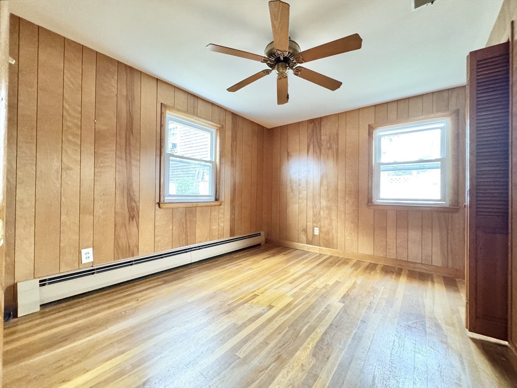 7 Roland Road Peabody, MA 01960 - Photo 14 of 24 a view of an empty room with a window and wooden floor