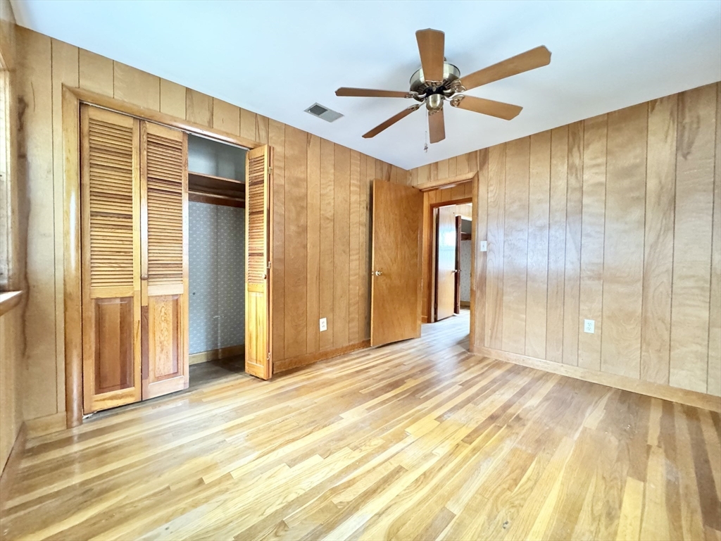 7 Roland Road Peabody, MA 01960 - Photo 15 of 24 a view of a livingroom with a chandelier fan and a wooden floor