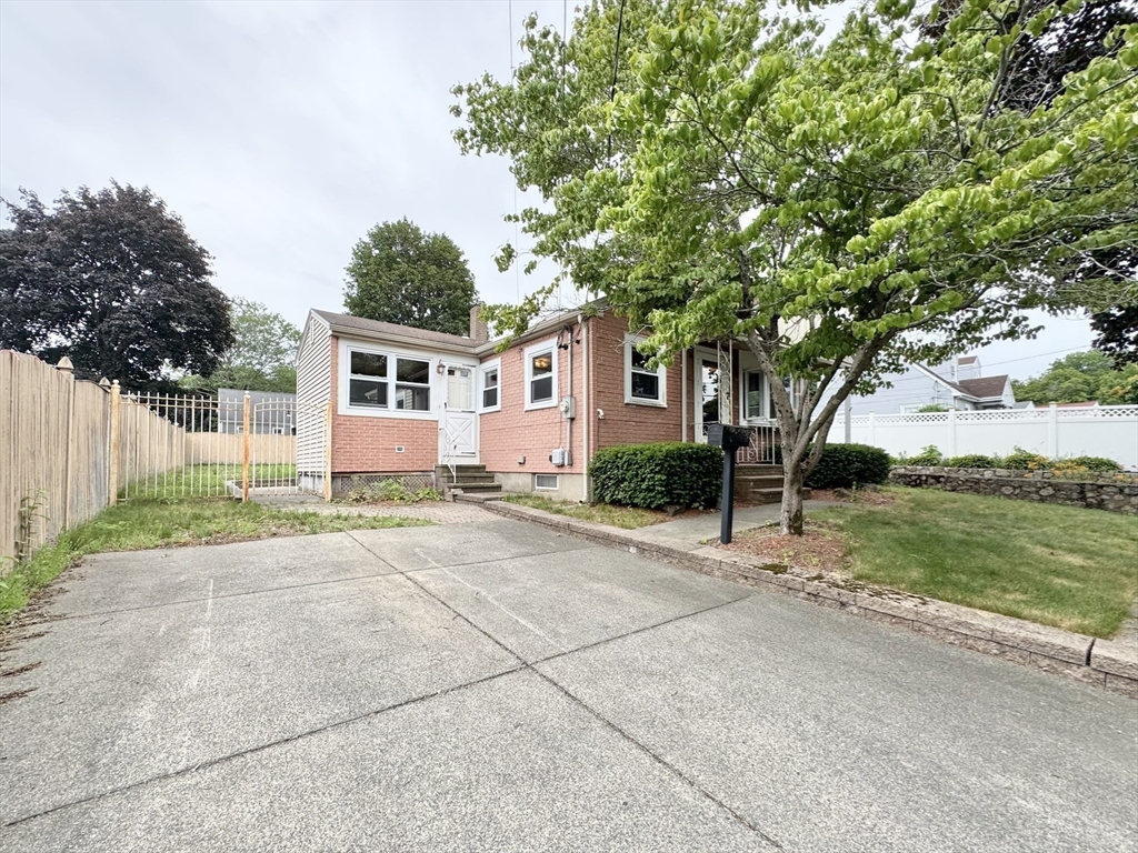 7 Roland Road Peabody, MA 01960 - Photo 23 of 24 a front view of house with yard and trees around