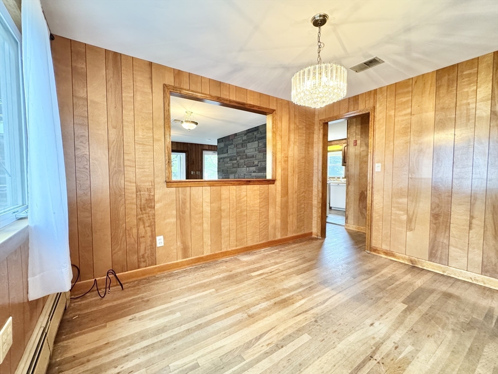 7 Roland Road Peabody, MA 01960 - Photo 8 of 24 a view of an entryway with wooden floor and door