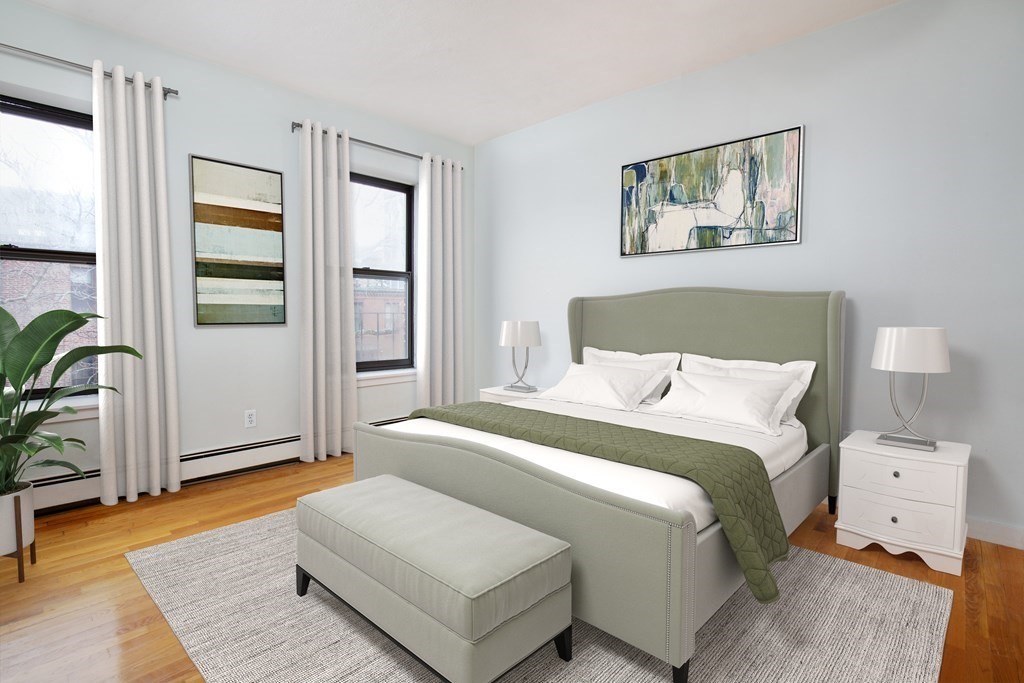 28 Worcester Square, Unit 4 Boston, MA 02118 - Photo 4 of 7 a bedroom with a large bed and a window