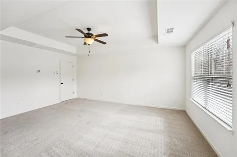 a view of empty room with wooden walls
