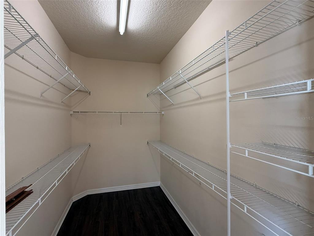 14163 Cattle Egret PIace Lakewood Ranch, FL 34202 - Photo 18 of 50 a view of storage and utility room with racks on the wall