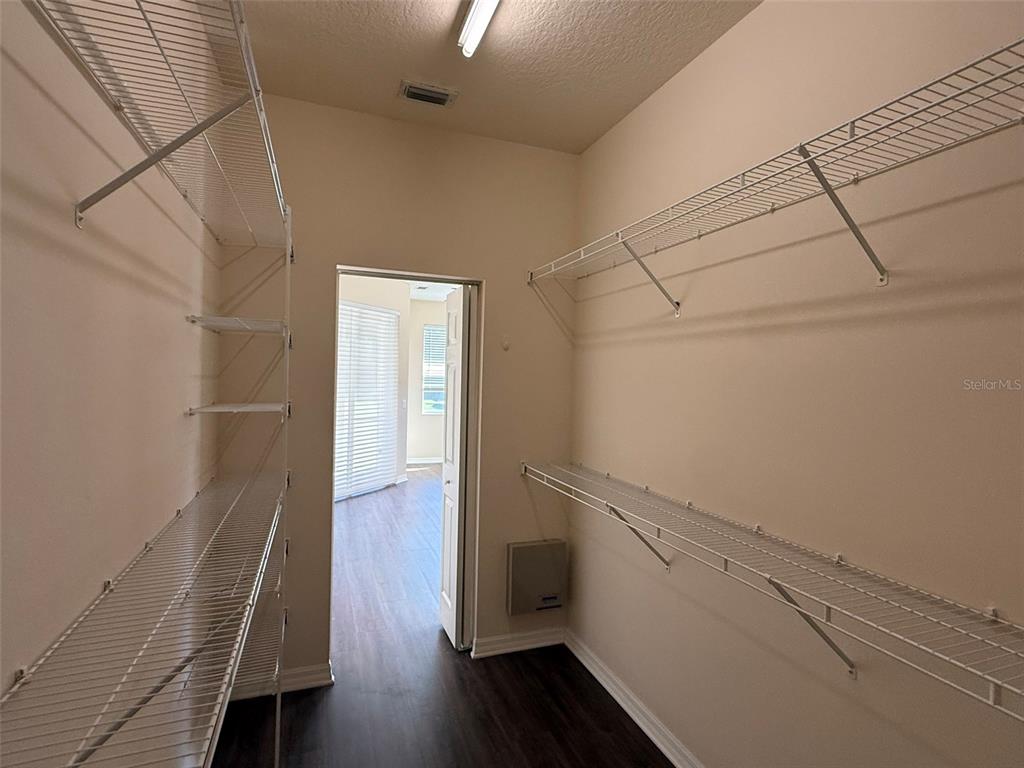 14163 Cattle Egret PIace Lakewood Ranch, FL 34202 - Photo 19 of 50 a view of hallway with wooden floor