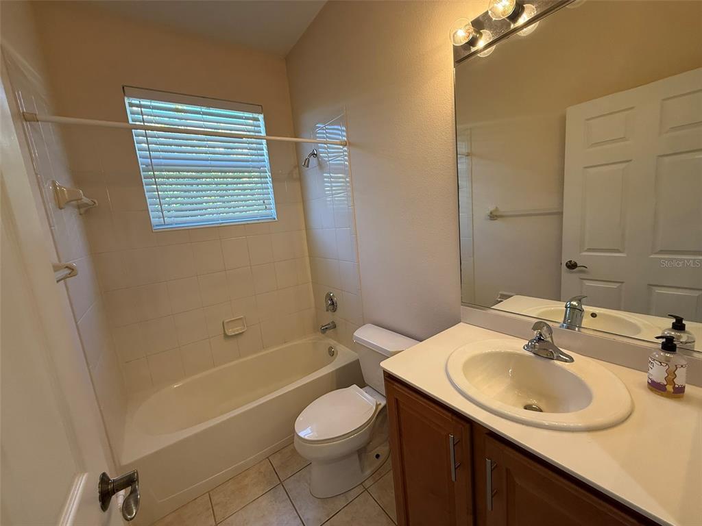 14163 Cattle Egret PIace Lakewood Ranch, FL 34202 - Photo 23 of 50 a bathroom with a sink toilet and shower