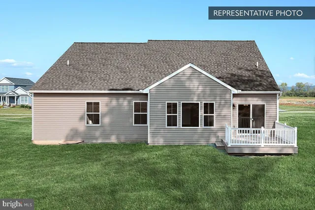 a front view of house with yard and outdoor seating
