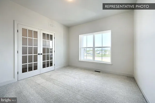 an empty room with windows