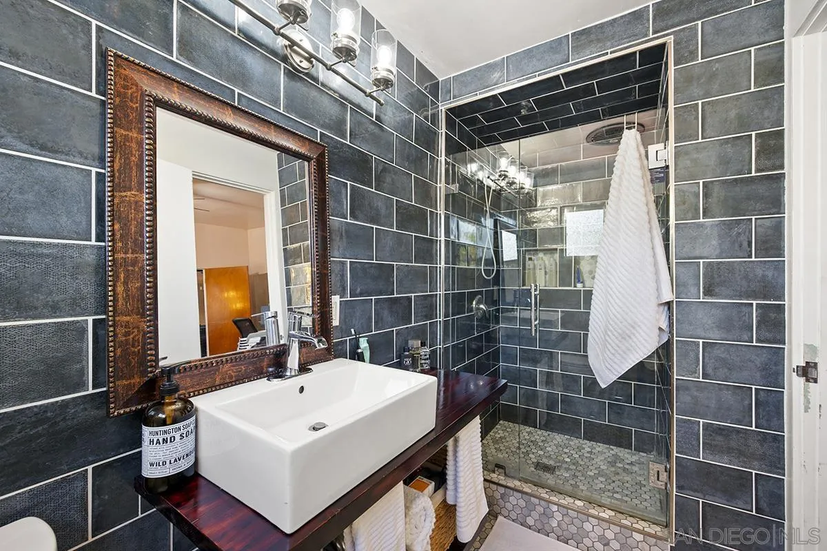 4310 Resmar Road La Mesa, CA 91941 - Photo 29 of 70 a bathroom with a sink toilet and shower