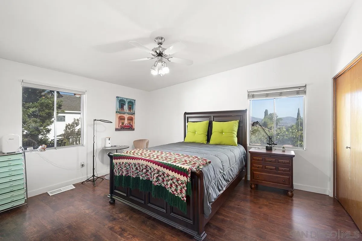 4310 Resmar Road La Mesa, CA 91941 - Photo 30 of 70 a bedroom with a bed a dresser and next to a window