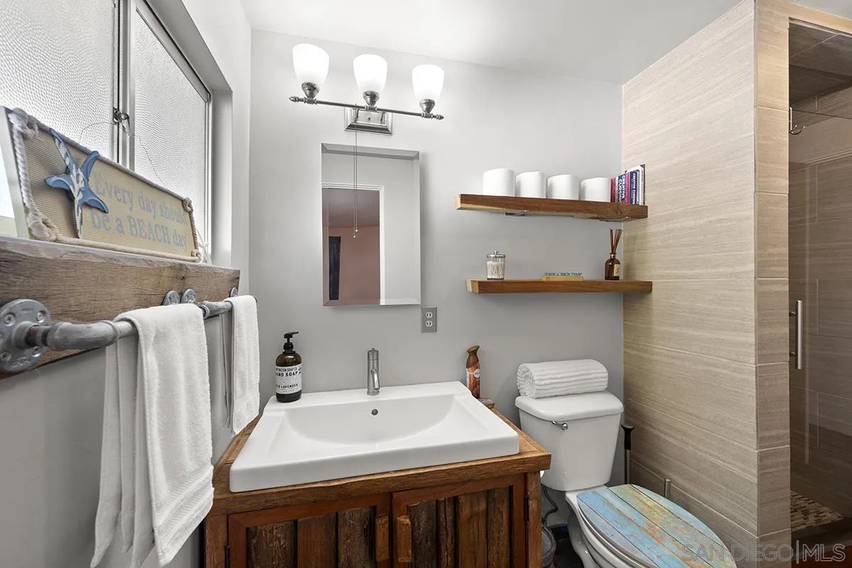 4310 Resmar Road La Mesa, CA 91941 - Photo 35 of 70 a bathroom with a sink and a toilet