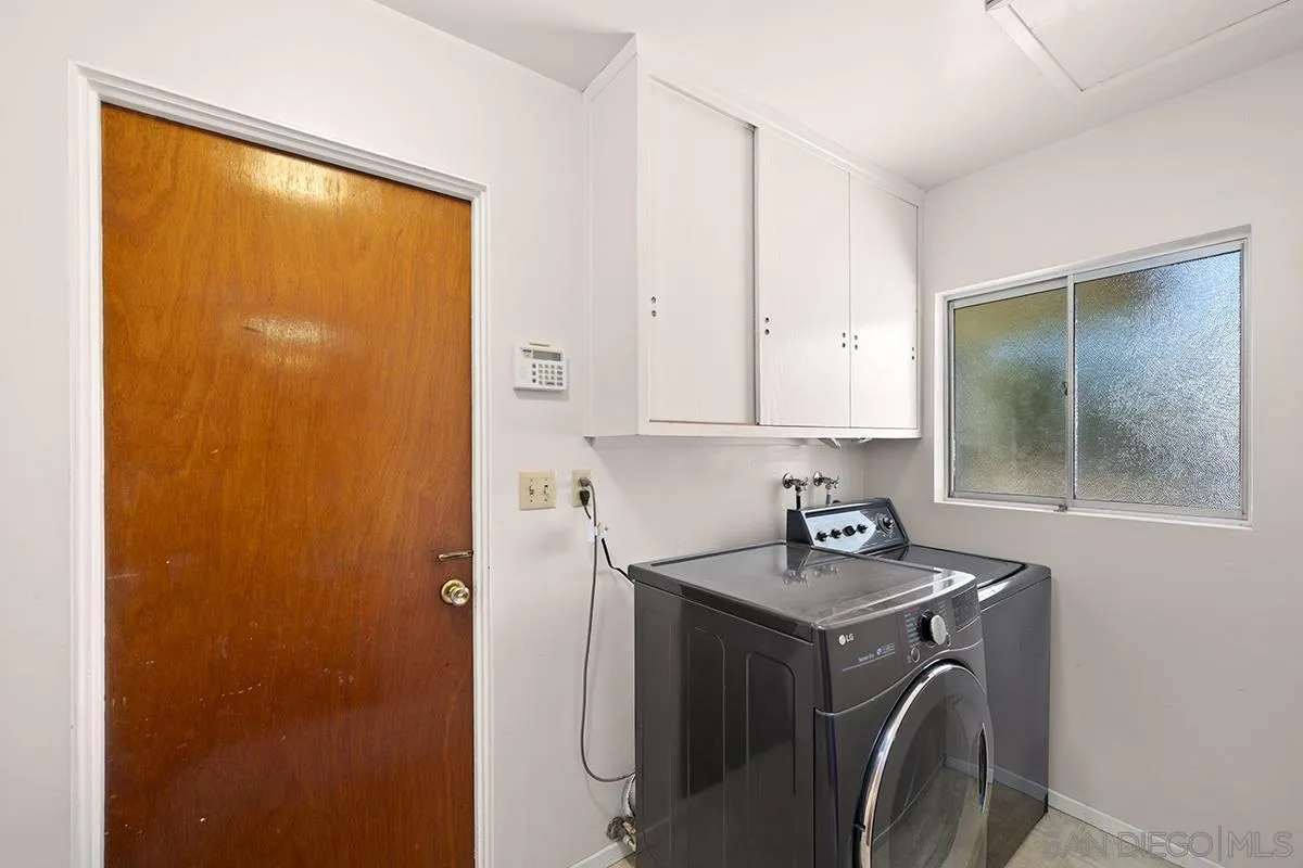 4310 Resmar Road La Mesa, CA 91941 - Photo 38 of 70 a view of storage and utility room with washer and dryer