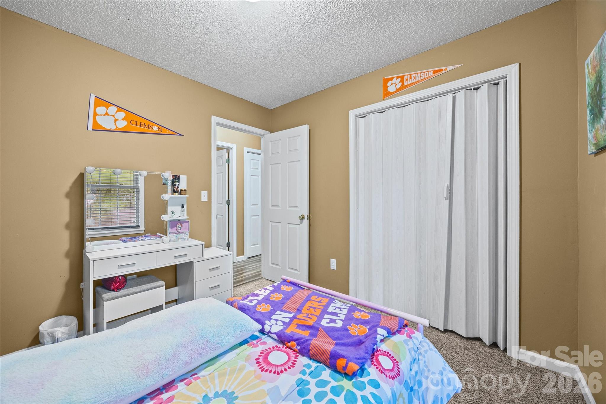 30 7th Street York, SC 29745 - Photo 17 of 29 a bedroom with a bed and a dresser in it