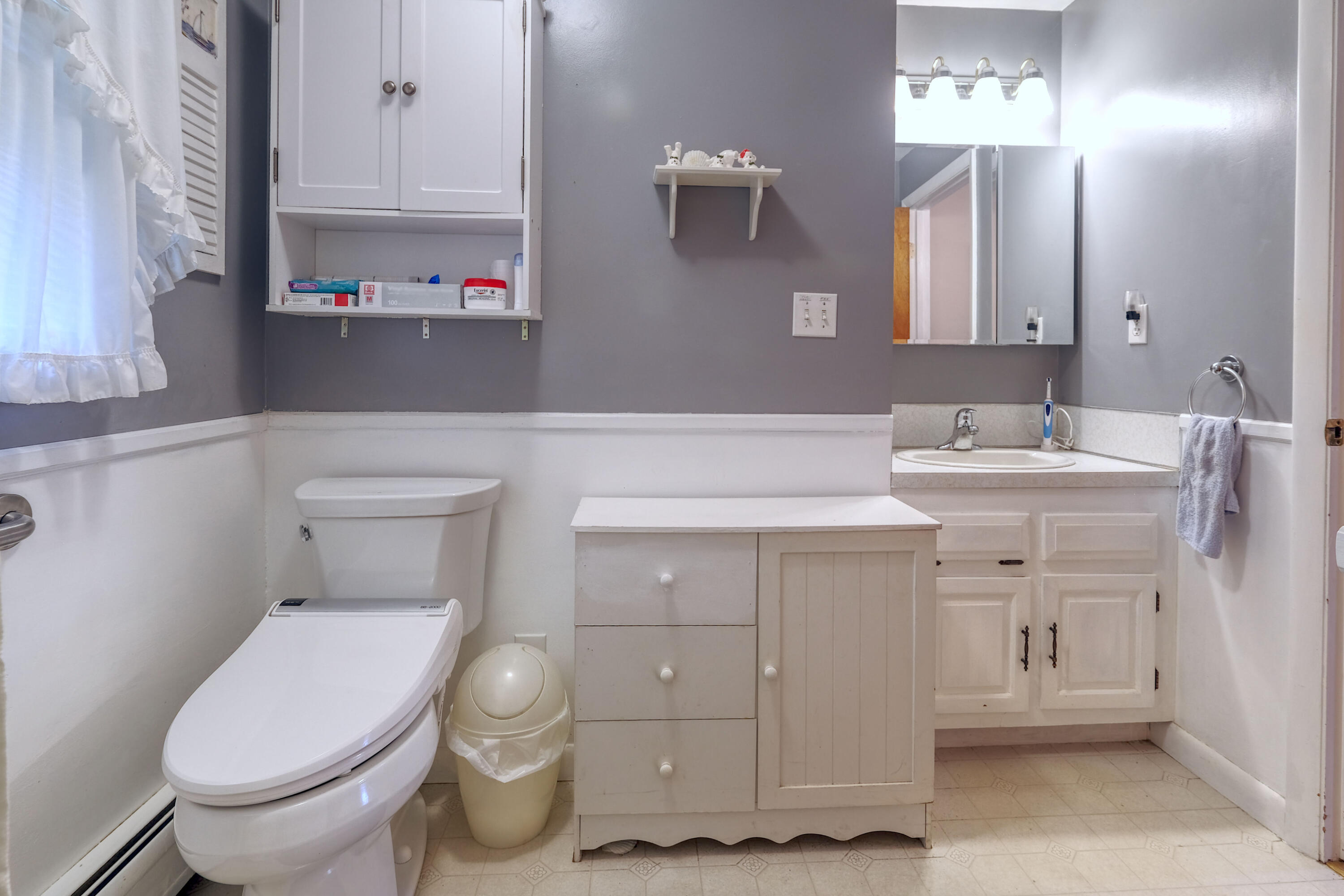103 Moco Road West Barnstable, MA 02668 - Photo 29 of 47 a bathroom with a sink toilet and vanity