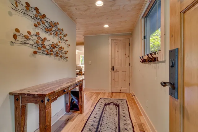 a view of a bathroom with a tub and shower curtain