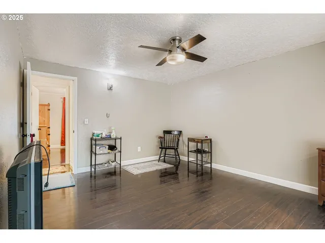 a view of a livingroom with furniture and wooden floor