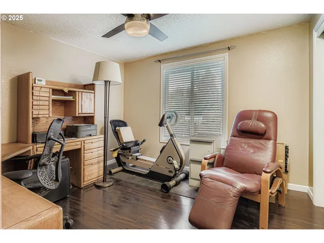 a room with furniture gym equipment and a view of living room