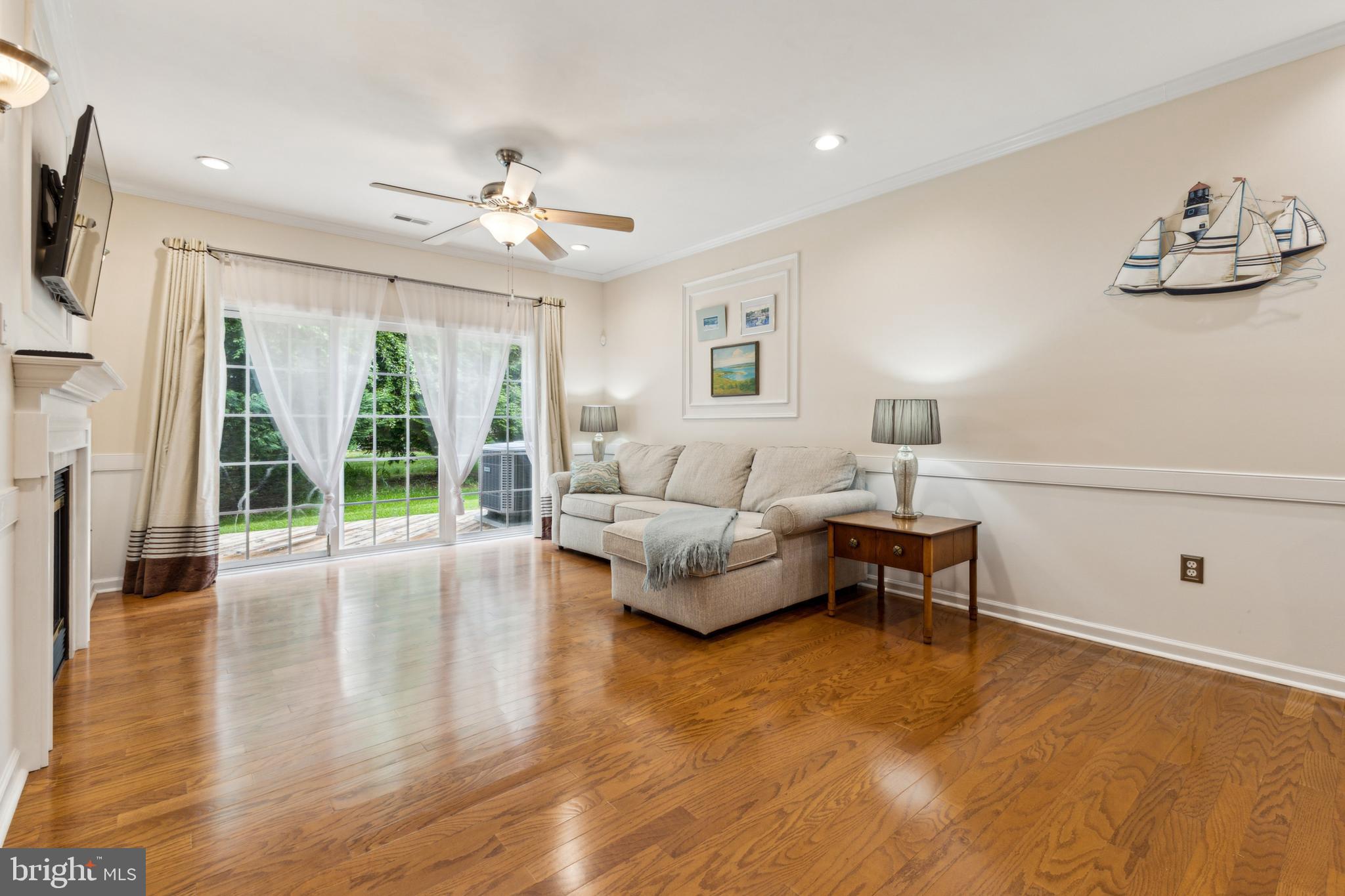 633 Ruxton Road, Unit 75 Solomons, MD 20629 - Photo 11 of 43 a living room with furniture and a large window