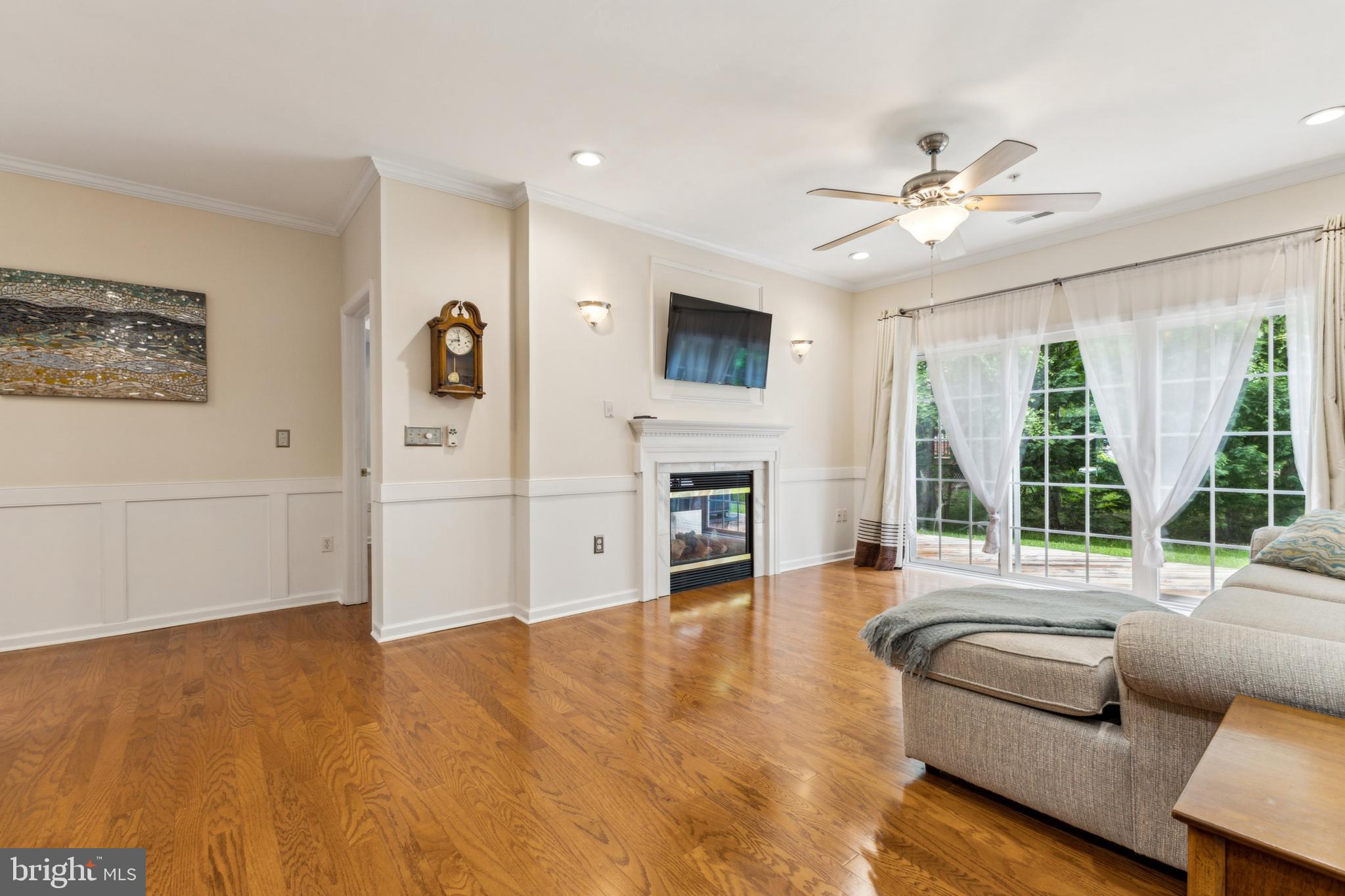 633 Ruxton Road, Unit 75 Solomons, MD 20629 - Photo 12 of 43 a living room with furniture and a fireplace