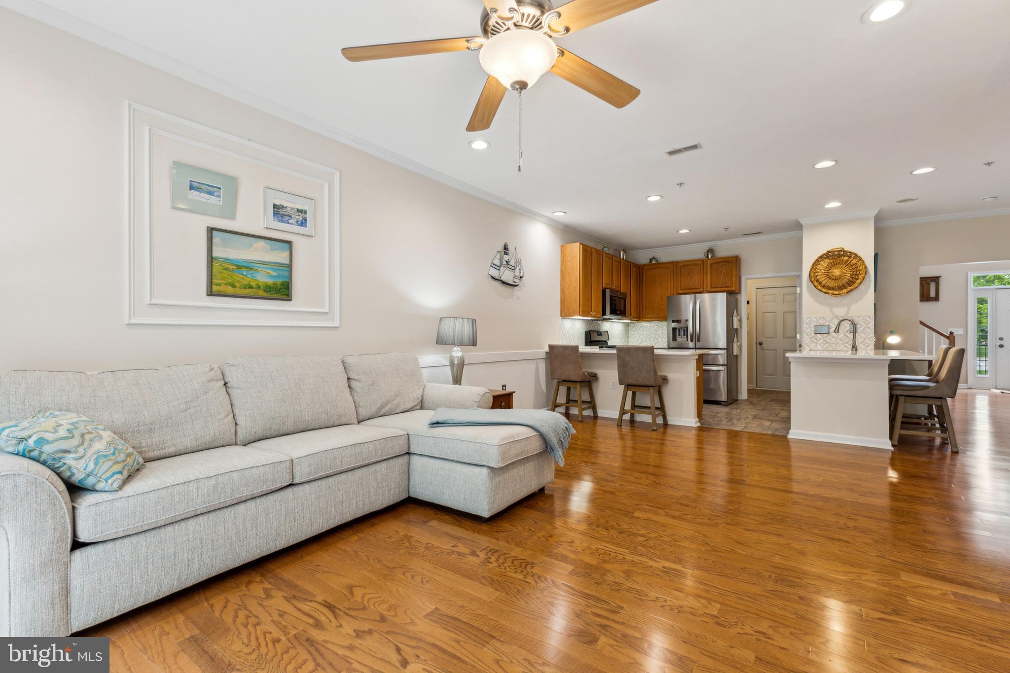 633 Ruxton Road, Unit 75 Solomons, MD 20629 - Photo 13 of 43 a living room with furniture and kitchen view