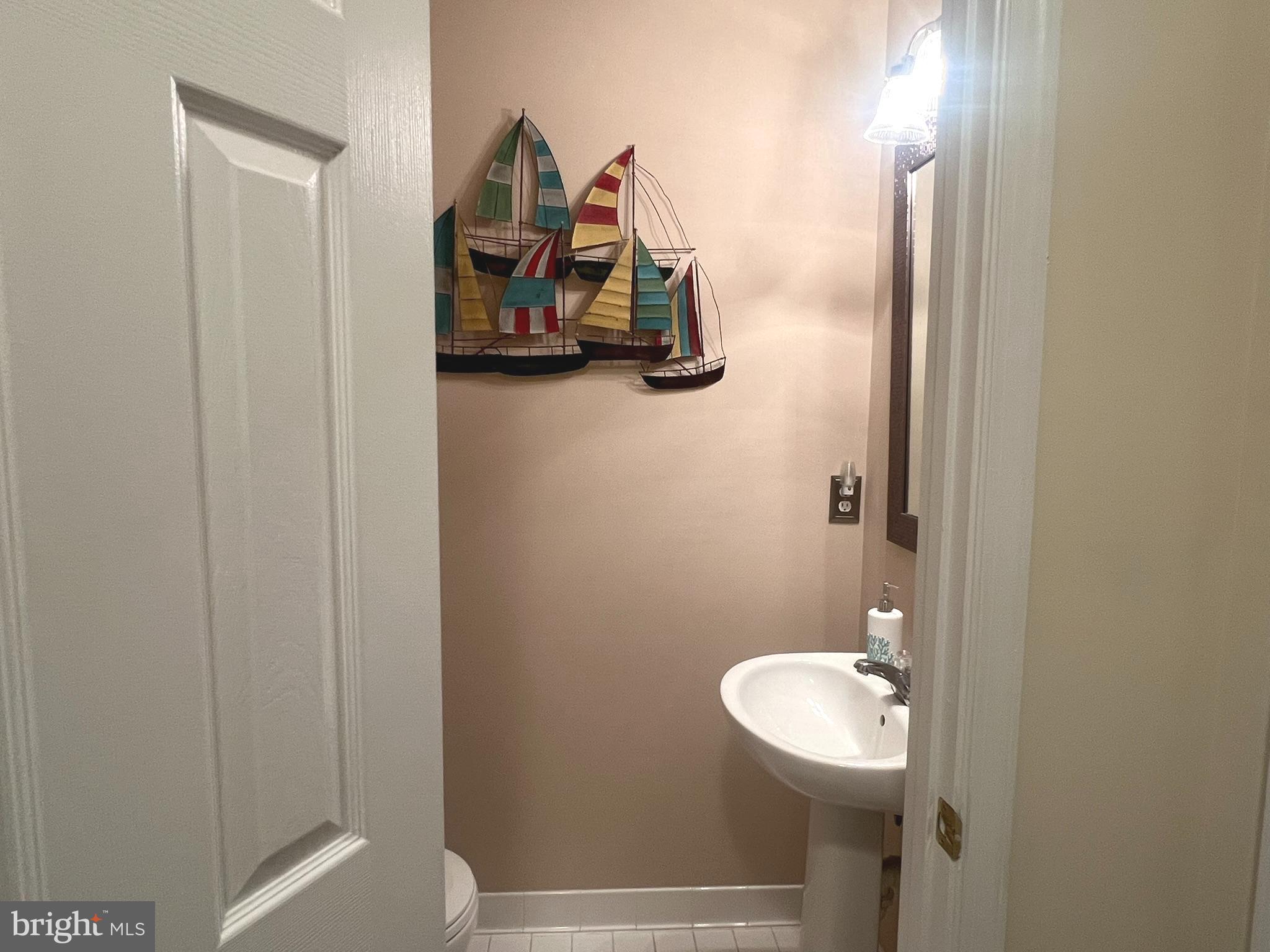 633 Ruxton Road, Unit 75 Solomons, MD 20629 - Photo 17 of 43 a bathroom with a toilet and a sink