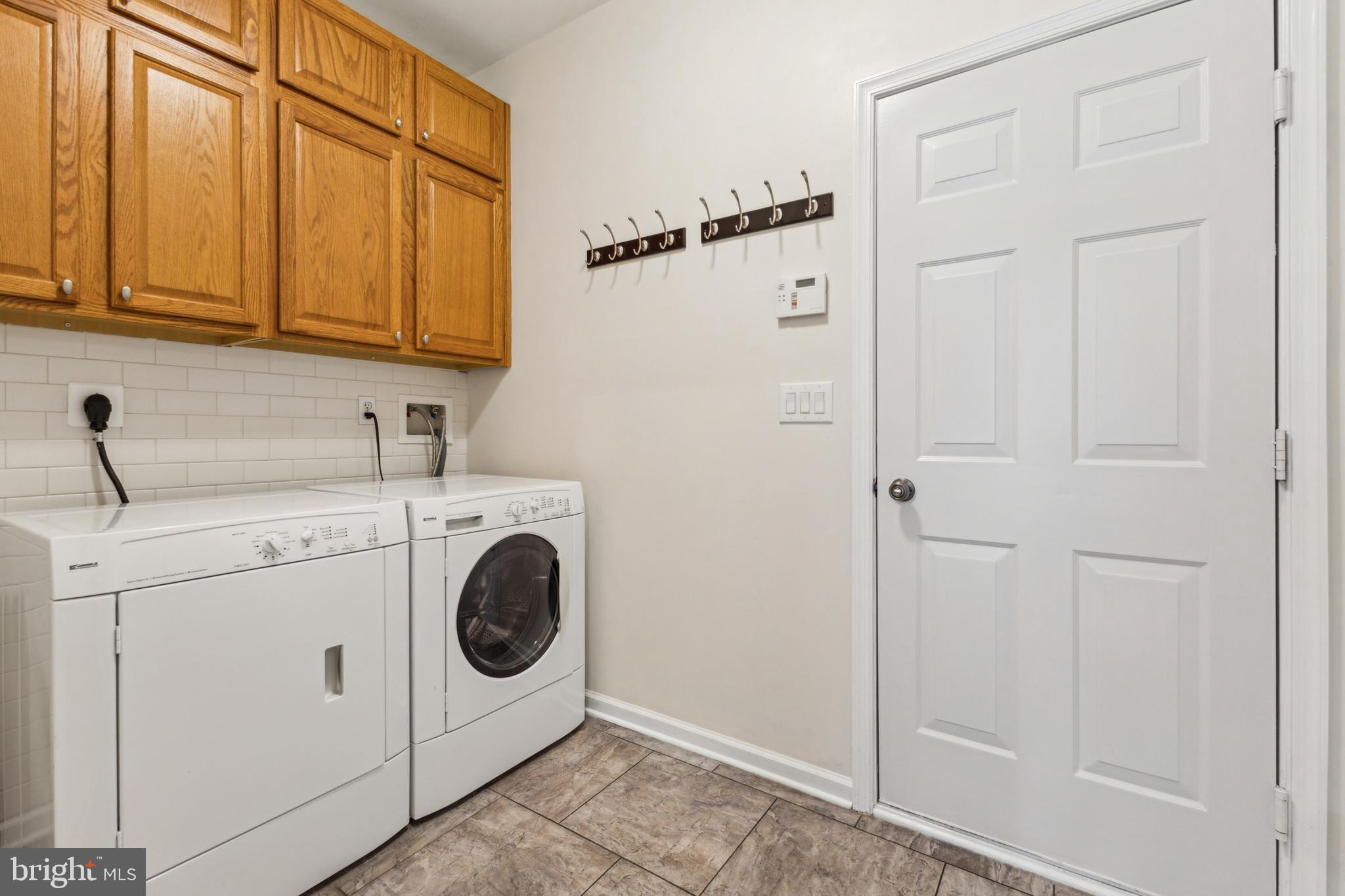 633 Ruxton Road, Unit 75 Solomons, MD 20629 - Photo 19 of 43 a utility room with dryer and washer
