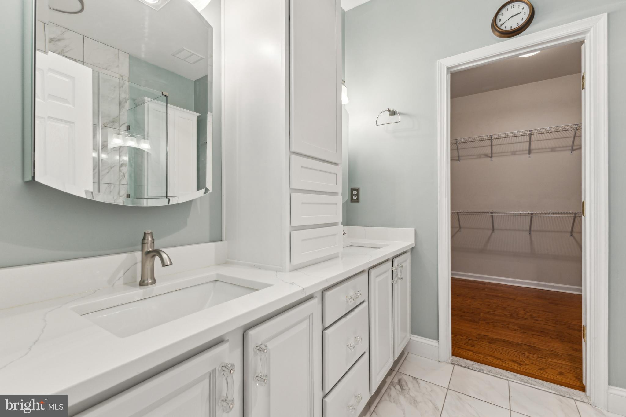 633 Ruxton Road, Unit 75 Solomons, MD 20629 - Photo 24 of 43 a bathroom with a sink and a mirror